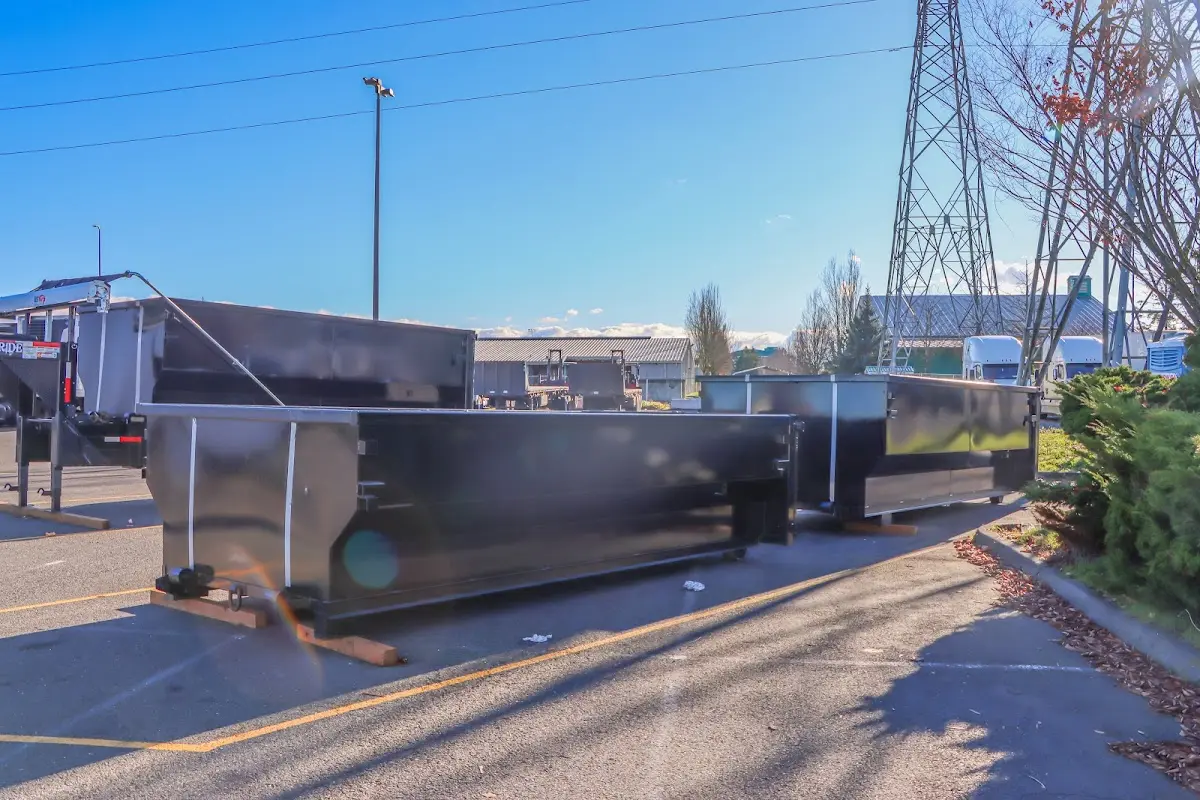 Roll-off dumpster ready for waste disposal at job site for 12 Yard Dumpster Rental in West Pensacola